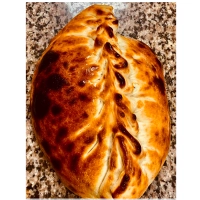 dicht gevouwen pizza met shoarma,paprika,ui en champignons